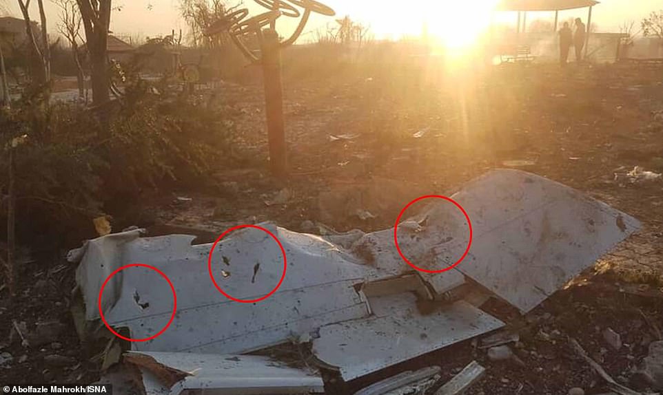 23139596 7868035 Pieces of debris are seen lying at the crash site in a picture r a 46 1578588999858
